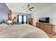 View of the primary bedroom with large window and furniture at 5735 Bungalow Grove Ct, Palmetto, FL 34221