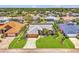 Aerial view of single-story house, showcasing the lawn, landscaping, and neighborhood at 5742 39Th Street E Cir, Bradenton, FL 34203
