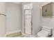 Bathroom with a shower, toilet, storage and wood look floors at 5742 39Th Street E Cir, Bradenton, FL 34203