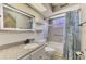 Bathroom with tub, shower, decorative shower curtain, updated vanity and bright lighting at 5742 39Th Street E Cir, Bradenton, FL 34203