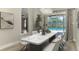 Elegant dining room with modern chandelier, table, and sliding door at 5742 39Th Street E Cir, Bradenton, FL 34203