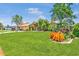 Beautiful home with manicured landscaping, lush green lawn and mature trees in a Gathering friendly neighborhood at 5742 39Th Street E Cir, Bradenton, FL 34203