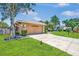 Exterior shot of a home with a spacious two-car garage and well-maintained landscaping at 5742 39Th Street E Cir, Bradenton, FL 34203