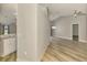 Spacious hallway showcasing light wood floors and leading to an open-concept living space at 5742 39Th Street E Cir, Bradenton, FL 34203
