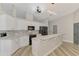 Updated kitchen with modern appliances, a sleek design, and convenient breakfast bar seating at 5742 39Th Street E Cir, Bradenton, FL 34203