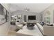 Bright living room with contemporary furnishings, a vaulted ceiling, and stylish decor at 5742 39Th Street E Cir, Bradenton, FL 34203