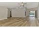 Expansive living room with light wood flooring and a view of the outdoor pool area at 5742 39Th Street E Cir, Bradenton, FL 34203