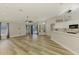 Open floor plan connecting the kitchen to the living room, offering a cohesive and spacious living area at 5742 39Th Street E Cir, Bradenton, FL 34203