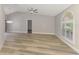 Bright, airy living room with a vaulted ceiling and a large arched window at 5742 39Th Street E Cir, Bradenton, FL 34203
