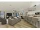 Comfortable living room and kitchen area with light wood floors and stylish decor at 5742 39Th Street E Cir, Bradenton, FL 34203