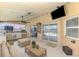 Outdoor patio with pool views, a tv, outdoor kitchen and outdoor furniture at 5742 39Th Street E Cir, Bradenton, FL 34203