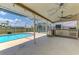 Outdoor patio with pool, outdoor kitchen and ceiling fan at 5742 39Th Street E Cir, Bradenton, FL 34203