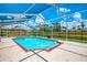 Beautiful screened pool with brick trim and a clear blue sky overhead at 5742 39Th Street E Cir, Bradenton, FL 34203