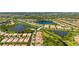Beautiful aerial view of a neighborhood with lakes and lush landscaping at 5866 Guarino Dr, Sarasota, FL 34238