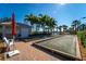 Outdoor bocce ball court with benches and lovely landscaping at 5866 Guarino Dr, Sarasota, FL 34238