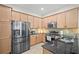 Modern kitchen showcasing stainless steel appliances, sleek countertops, and ample cabinet space for storage at 5866 Guarino Dr, Sarasota, FL 34238
