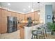 Modern kitchen boasting stainless steel appliances, granite countertops, ample cabinet space, and a convenient breakfast bar at 5866 Guarino Dr, Sarasota, FL 34238