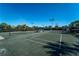 Community tennis courts with lighting for evening matches at 5866 Guarino Dr, Sarasota, FL 34238