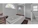 Bright bathroom featuring a soaking tub and a glass-enclosed shower at 6113 55Th E Ter, Bradenton, FL 34203