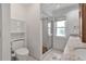 Bathroom featuring a glass-enclosed shower, granite countertop, and a built-in storage cabinet at 6113 55Th E Ter, Bradenton, FL 34203