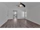 Bright bedroom featuring wood floors, neutral walls, and an ensuite bathroom at 6113 55Th E Ter, Bradenton, FL 34203