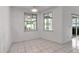 Bright dining area with white walls, tile floor, and sliding doors to outdoor area at 6113 55Th E Ter, Bradenton, FL 34203