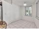 Bright dining area with white walls, tile floor, and sliding doors to outdoor area at 6113 55Th E Ter, Bradenton, FL 34203