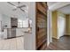 Modern kitchen with stainless steel appliances and granite countertops, seamlessly connecting to the living area at 6113 55Th E Ter, Bradenton, FL 34203