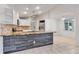 Island kitchen featuring granite countertop, tiled backsplash, and tiled flooring at 6113 55Th E Ter, Bradenton, FL 34203