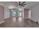 Inviting living room featuring archways, wood-look flooring, and ample natural light at 6113 55Th E Ter, Bradenton, FL 34203