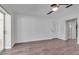 Bright living room with wood floors, ceiling fan, and sliding door to the outdoors at 6113 55Th E Ter, Bradenton, FL 34203