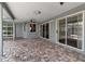 Large covered brick patio offers ample space for entertaining with multiple access points into the home at 6113 55Th E Ter, Bradenton, FL 34203