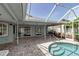 Screened in pool area with brick pavers and adjacent to the house through glass sliding doors at 6113 55Th E Ter, Bradenton, FL 34203