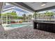 Sparkling pool with screened enclosure and outdoor kitchen area, perfect for entertaining guests at 6113 55Th E Ter, Bradenton, FL 34203