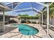 Gorgeous pool within a screened lanai offering privacy and relaxation in a lush tropical setting at 6113 55Th E Ter, Bradenton, FL 34203