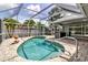Enjoy the Florida sunshine in this private screened-in pool surrounded by lush tropical landscaping at 6113 55Th E Ter, Bradenton, FL 34203