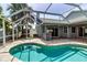 Inviting pool surrounded by screened enclosure and beautiful landscaping providing a private oasis at 6113 55Th E Ter, Bradenton, FL 34203