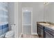 En suite bathroom featuring walk-in closet at 6125 Anise Dr, Sarasota, FL 34238
