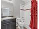 Clean bathroom with vanity sink, toilet, and shower-tub combo at 6125 Anise Dr, Sarasota, FL 34238