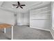 Bonus room featuring neutral carpet and custom shelving at 6125 Anise Dr, Sarasota, FL 34238