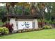 Community sign for Arbor Lakes on Palmer Ranch surrounded by landscaped plants at 6125 Anise Dr, Sarasota, FL 34238