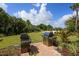 A common grilling area features two stainless steel grills and a brick-paved area at 6125 Anise Dr, Sarasota, FL 34238