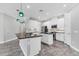 Well-lit kitchen featuring white cabinets, stainless steel appliances, and sleek black countertops at 6125 Anise Dr, Sarasota, FL 34238