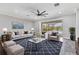 Inviting living room featuring stylish furniture, a cozy rug, and a view of the pool at 6125 Anise Dr, Sarasota, FL 34238