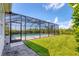 A screened pool enclosure and patio create the perfect backyard oasis for relaxation and entertaining at 6125 Anise Dr, Sarasota, FL 34238