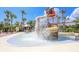 Community splash pad with a water feature and palm trees, perfect for Gathering fun at 6125 Anise Dr, Sarasota, FL 34238