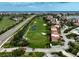 An aerial view shows condo buildings bordering a golf course and scenic waterway at 6372 Palma Del Mar S Blvd # 503, St Petersburg, FL 33715
