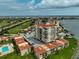 Gorgeous aerial view of waterfront condos near a golf course with a pool at 6372 Palma Del Mar S Blvd # 503, St Petersburg, FL 33715