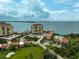 Beautiful aerial view of the condos, landscaping, golf course, and ocean views at 6372 Palma Del Mar S Blvd # 503, St Petersburg, FL 33715
