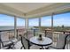 Outdoor seating area featuring a table with four chairs, and wide, expansive views of the waterway at 6372 Palma Del Mar S Blvd # 503, St Petersburg, FL 33715